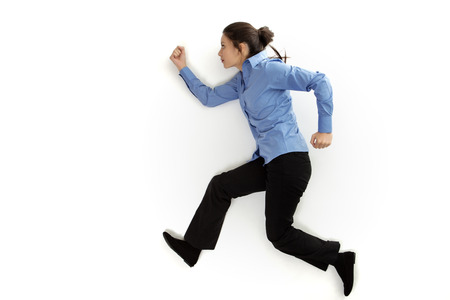 shot from above with the model lying on the ground as if she is runningの写真素材