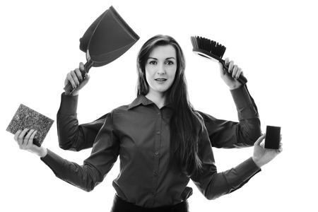 woman with many arms holding different objects in each hand to clean up withの写真素材