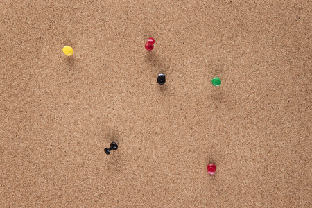 plain cork pin board with pins in itの写真素材