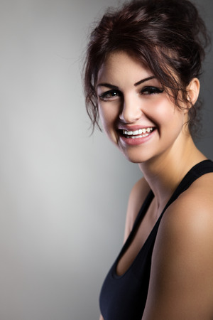 Happy fitness model shot in the studioの写真素材