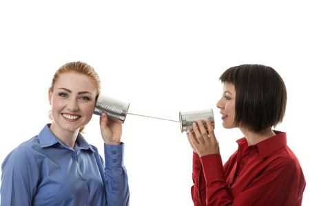 two business people using tin cans to communicate with each other