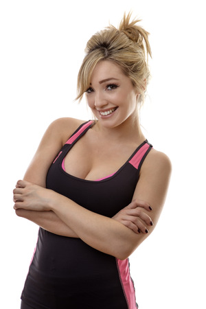 happy fitness woman stand isolated on white backgroundの写真素材