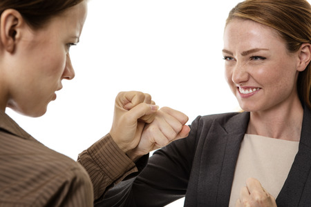 two business woman mad and fighting each other