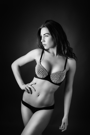 sexy woman wearing metal studded braの写真素材