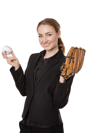 Upper body studio shot of a happy, pretty business model holding a baseball and a catchers glove.  Isolated on whiteの写真素材