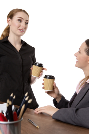shot of two pretty female collegues enjoying a coffee.の写真素材
