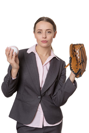 Upper body studio shot of a happy, pretty business model holding a baseball and a catchers glove.  Isolated on whiteの写真素材