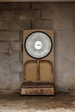 big old well used scales so fishermen can weigh there catch of the dayの写真素材