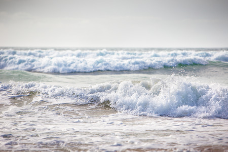 waves of the sea breaking on the beach