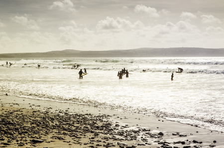 many people in the sea enjoying their holidayの写真素材