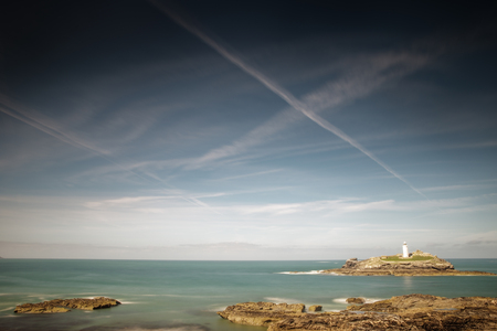 landscape shot of  the light house at Godrevy beachの写真素材