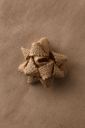 single wrapping bow on brown paperの写真素材