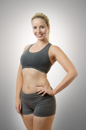 happy fitness model stand white background cut outの写真素材