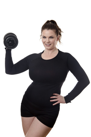 woman holding a single dumbbell flexing bicepの写真素材