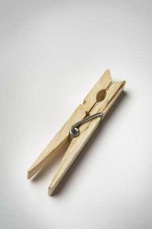 single wooden clothes peg on white backgroundの写真素材