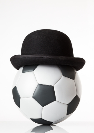 still life image of football wearing a bowler hatの写真素材
