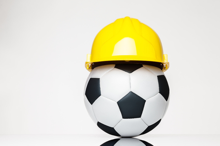 still life image of football wearing a hard hatの写真素材