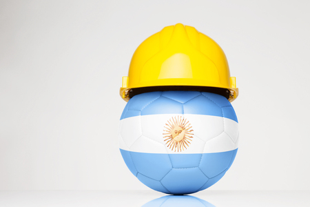 football wearing a hard hat with the Argentina flag superimposed on the footballの写真素材