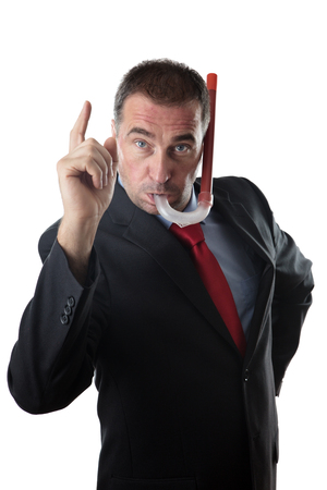 business man using a snorkel and wearing a business suitの写真素材