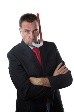 business man using a snorkel and wearing a business suitの写真素材