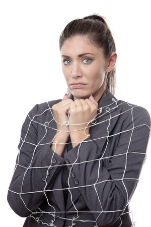 business woman caught up in a netの写真素材