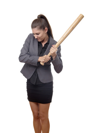 business woman swing a baseball bat at somethingの写真素材