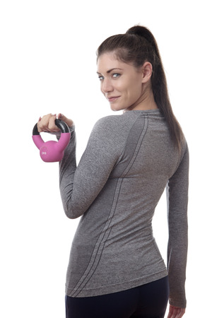 happy strong fitness woman using a kettlebellの写真素材