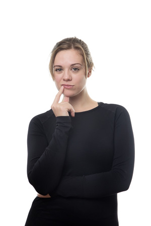 fitness woman all in black in deep thoughtの写真素材