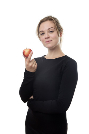 fitness woman all in black holding a appleの写真素材