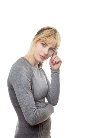 fitness woman standing thinking to herselfの写真素材