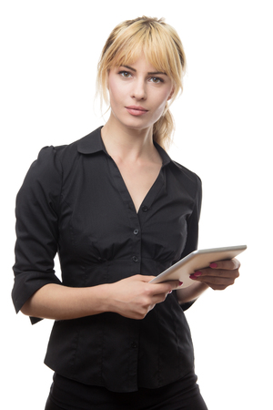 blonde haired business woman using a tablet computerの写真素材