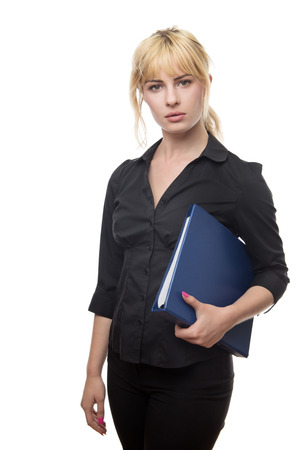blonde haired business woman holding a work fileの写真素材