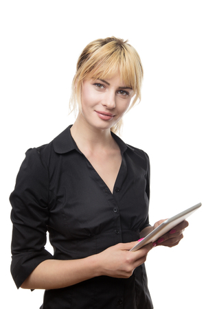blonde haired business woman using a tablet computerの写真素材