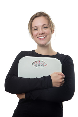 fitness woman wearing black holding scales の写真素材