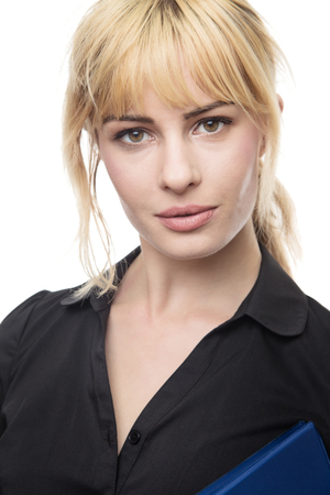 blonde haired business woman holding a work fileの写真素材