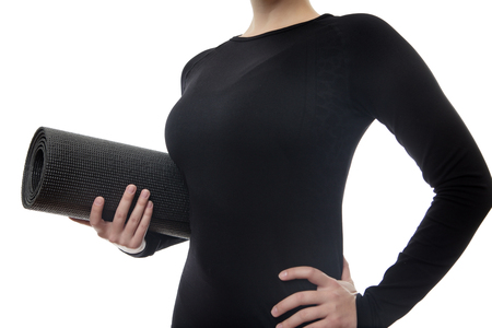 close up shot of woman holding a yoga matの写真素材