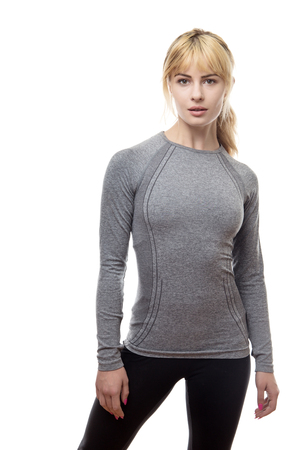 blonde hair woman wearing a grey gym top ready for the gymの写真素材