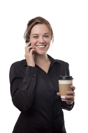 young business woman taling on the phone dinking a coffeeの写真素材