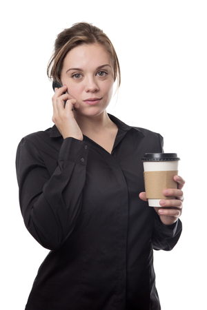 young business woman taling on the phone dinking a coffeeの写真素材