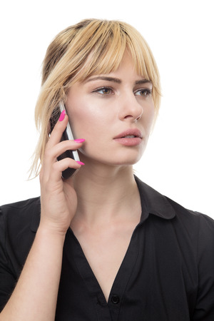 blonde haired business woman taking on her mobile phone の写真素材