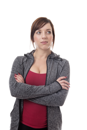 standing fitness woman wearing a tracksuit looking aroundの写真素材