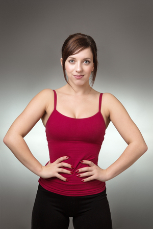 shot in the studio of young fitness woman looking at cameraの写真素材