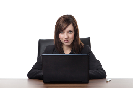 business woman siting at her desk at work の写真素材