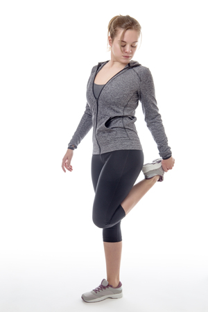 stretching female model on white backgroundの写真素材