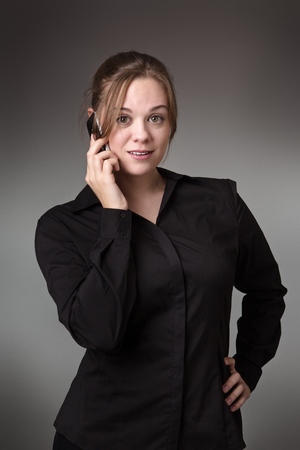 young business woman talking on her mobile phoneの写真素材