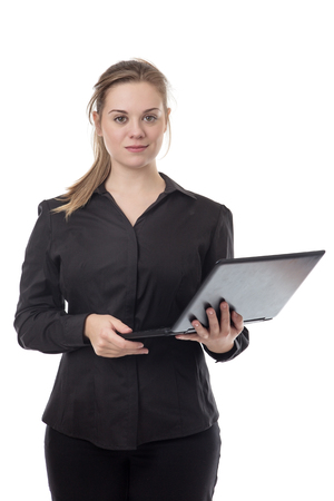 standing young business woman using a computer の写真素材