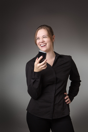 young business woman talking on her mobile phoneの写真素材
