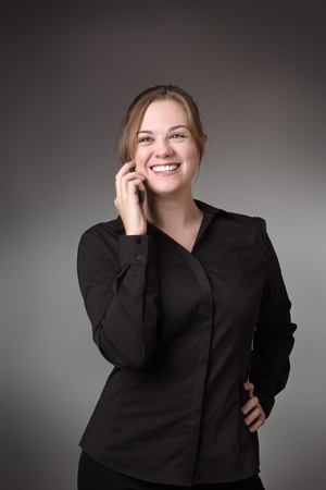 young business woman talking on her mobile phoneの写真素材