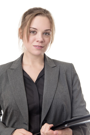 standing young business woman using a computer の写真素材