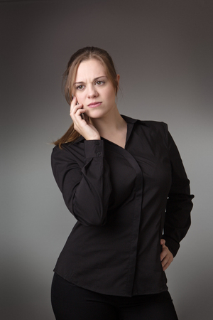 young business woman talking on her mobile phoneの写真素材